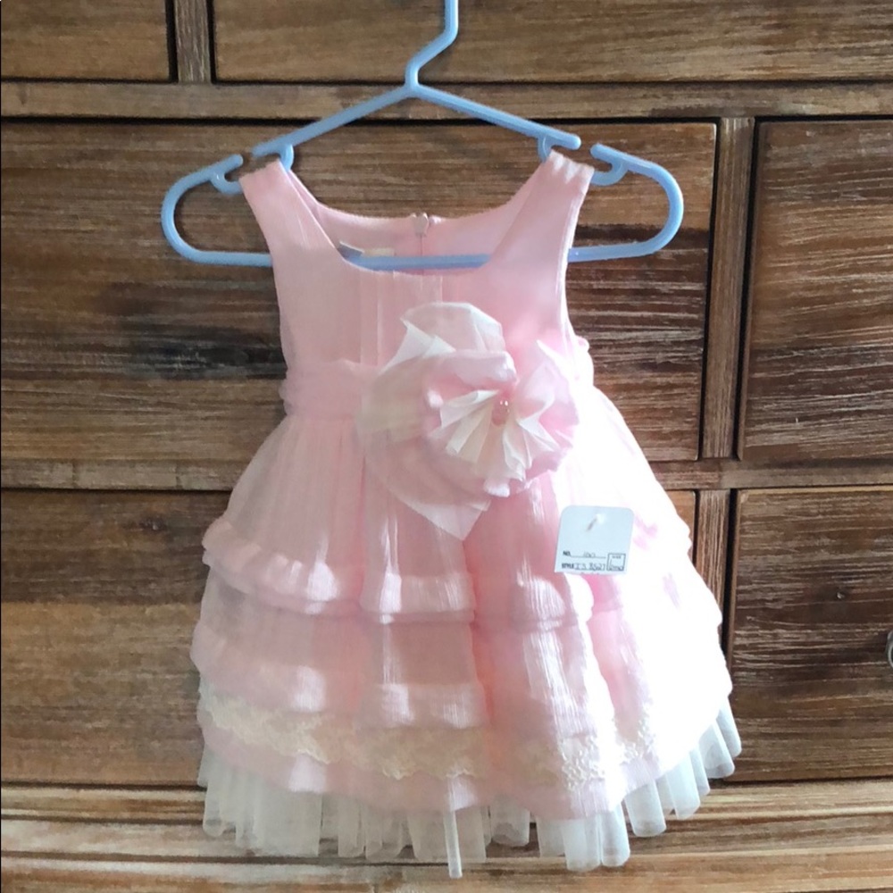 6 month dress. Brand new.